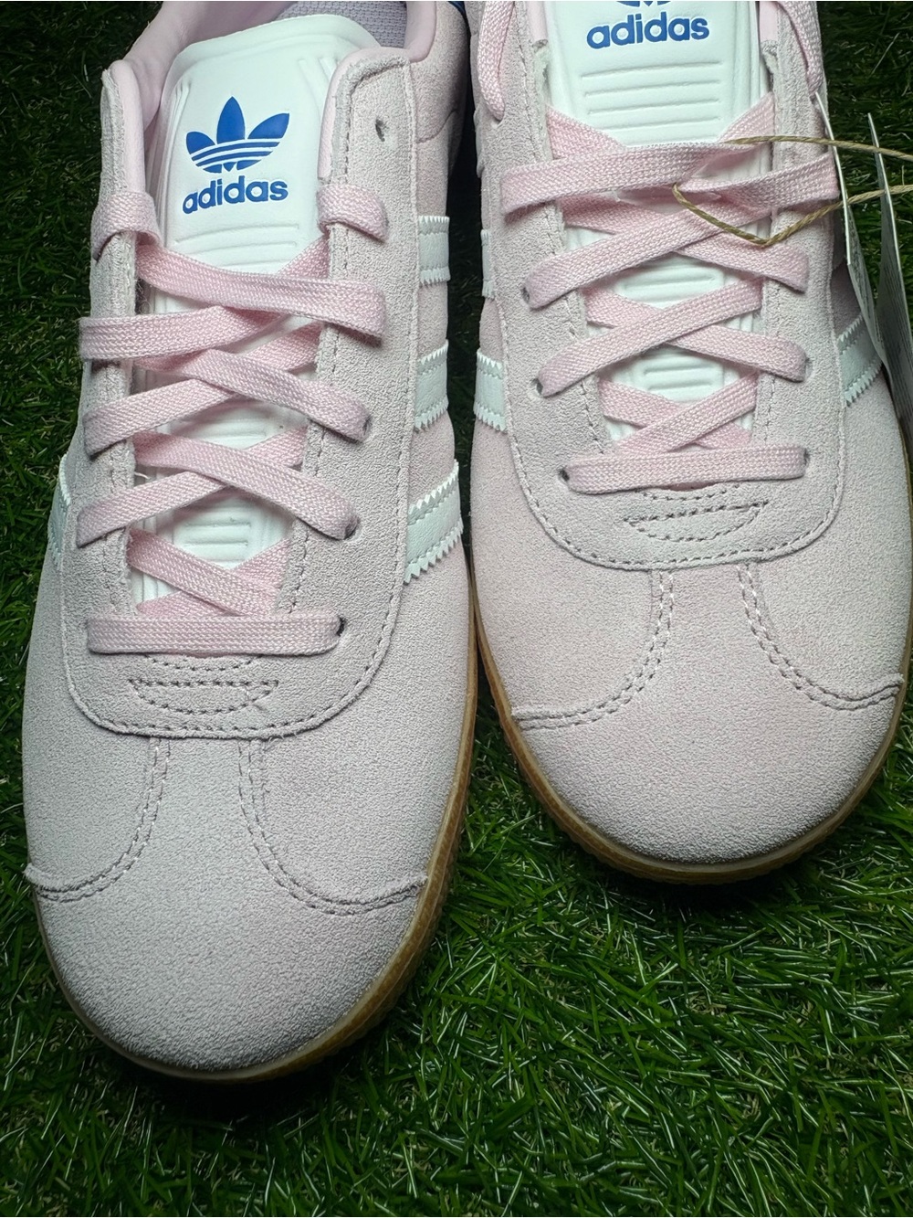 Adidas Gazelle Suede Sneakers in Light Pink with white Stripes and a blue heel. - Picture 3 of 8